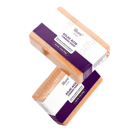 Illure Skin Kojic Acid & Turmeric Soap bar on a wooden surface with natural elements in the background.
